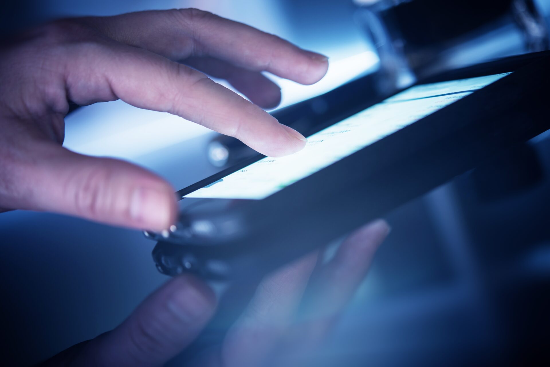 Using Mobile Smartphone Application. Female Hand on Modern Smartphone Closeup Photo.