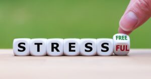 Lettered dice spell out Stressful and Stress Free